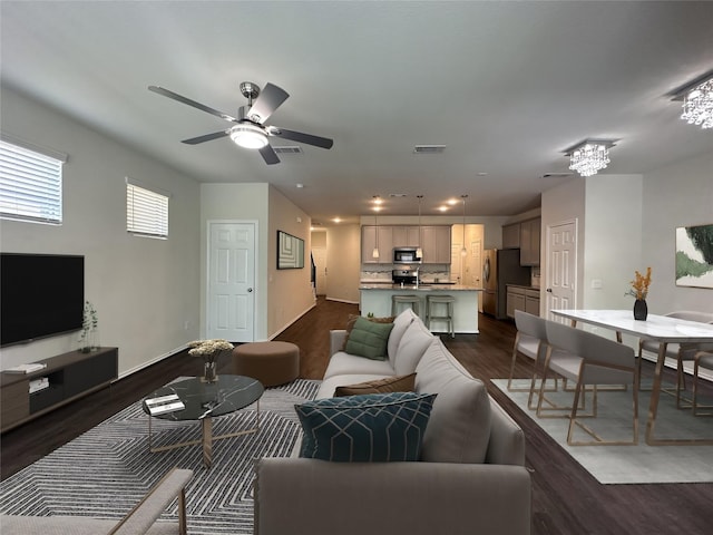 10967 Cannes Memorial Dr, Houston, TX 77043 - living area featuring dark wood finished floors, ceiling fan, recessed lighting, and a chandelier
