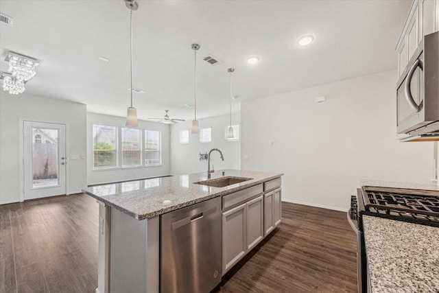 10967 Cannes Memorial Dr, Houston, TX 77043 - kitchen with appliances with stainless steel finishes, dark wood-type flooring, pendant lighting, an island with sink, and recessed lighting