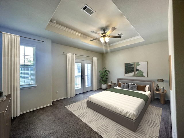 10967 Cannes Memorial Dr, Houston, TX 77043 - carpeted bedroom with a tray ceiling, access to outside, multiple windows, ornamental molding, and french doors