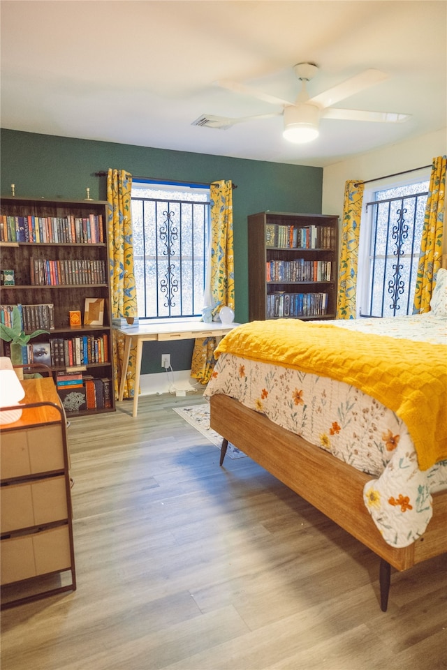 5205 Kashmere St, Houston, TX 77026 - bedroom with multiple windows and wood finished floors