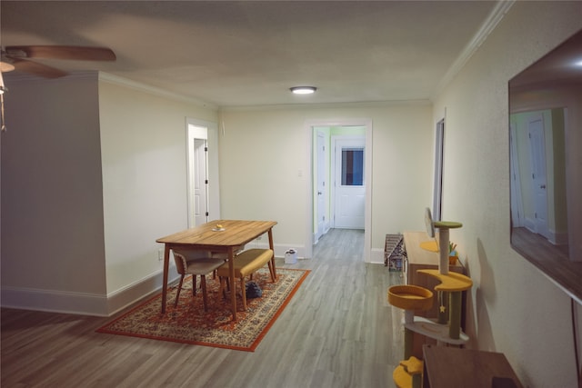 5205 Kashmere St, Houston, TX 77026 - dining space with a ceiling fan, wood finished floors, and crown molding