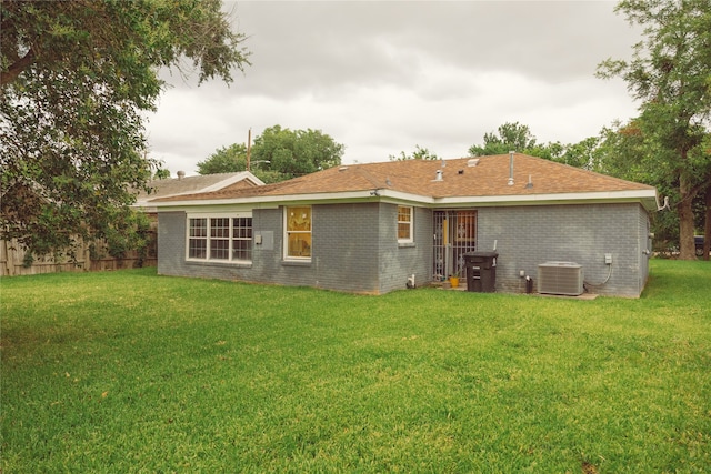 5205 Kashmere St, Houston, TX 77026 - rear view of house with a yard and brick siding