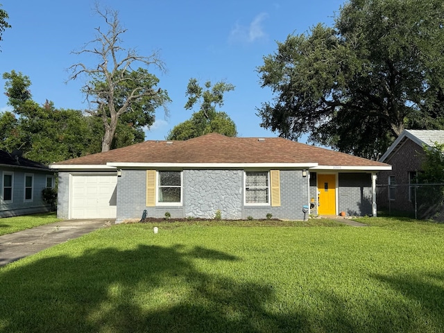5205 Kashmere St, Houston, TX 77026 - ranch-style home featuring driveway, a garage, and brick siding