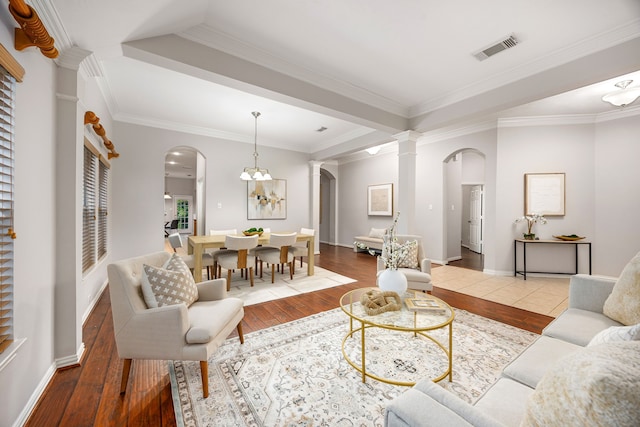 18419 S Raven Shore Dr, Cypress, TX 77433 - living area with arched walkways, hardwood / wood-style floors, ornate columns, and ornamental molding