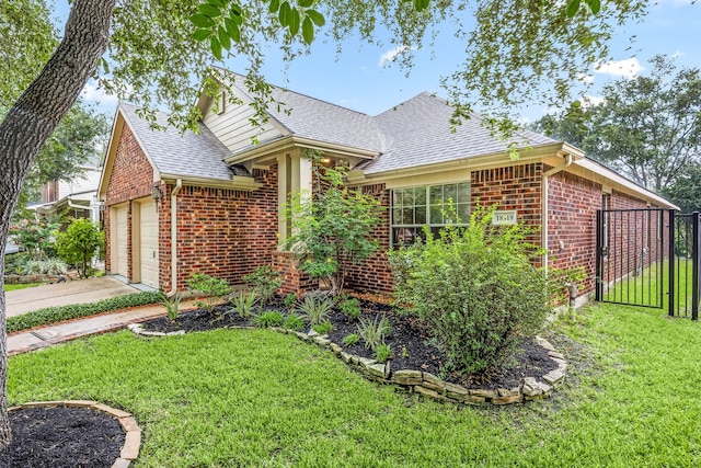 18419 S Raven Shore Dr, Cypress, TX 77433 - view of front of home featuring brick siding, a shingled roof, an attached garage, and a gate