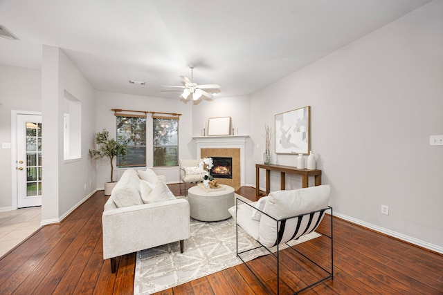18419 S Raven Shore Dr, Cypress, TX 77433 - living area with wood-type flooring, a fireplace, and ceiling fan