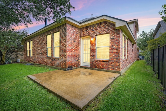 18419 S Raven Shore Dr, Cypress, TX 77433 - rear view of house with brick siding and a fenced backyard