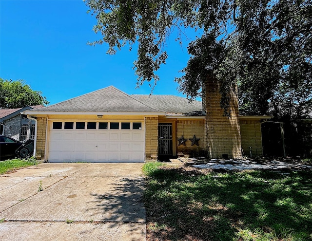 9518 Langdon Ln, Houston, TX 77036 - ranch-style home featuring an attached garage, driveway, brick siding, and a chimney