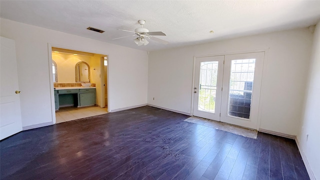 9518 Langdon Ln, Houston, TX 77036 - spare room featuring ceiling fan and hardwood / wood-style floors