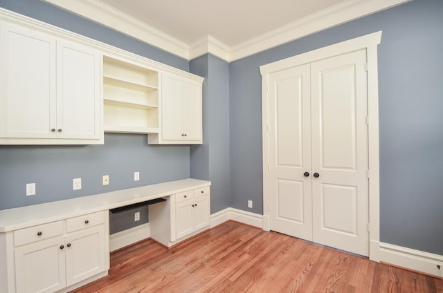 626 E 22nd St, Houston, TX 77008 - unfurnished office with built in desk, light wood-style floors, and crown molding