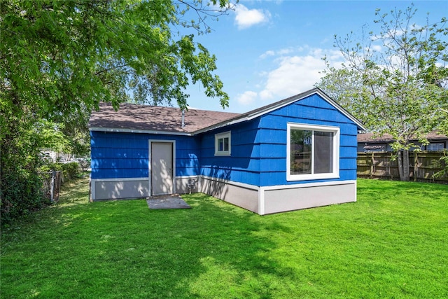5206 Willow Glen Dr, Houston, TX 77033 - back of house with a fenced backyard and a shingled roof