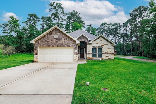 5 Corkwood Rd, Trinity, TX 75862 - french country inspired facade featuring concrete driveway, an attached garage, a front yard, and brick siding