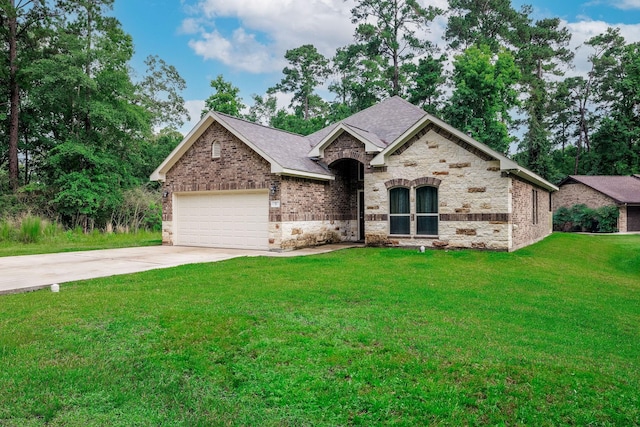 5 Corkwood Rd, Trinity, TX 75862 - french provincial home with an attached garage, concrete driveway, a front yard, stone siding, and brick siding