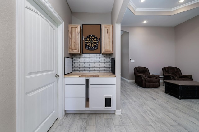 5 Corkwood Rd, Trinity, TX 75862 - bar area featuring recessed lighting, backsplash, light wood finished floors, and ornamental molding