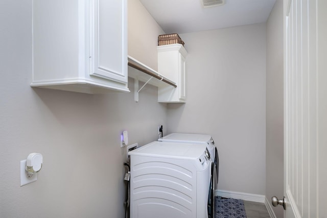 5 Corkwood Rd, Trinity, TX 75862 - laundry area featuring separate washer and dryer and cabinet space