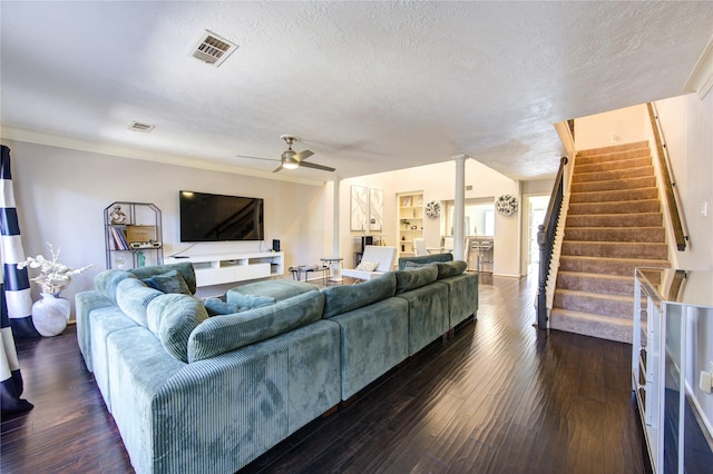 5830 Sampley Way Unit 5830, Houston, TX 77092 - living area with a ceiling fan, decorative columns, stairs, dark wood-type flooring, and a textured ceiling