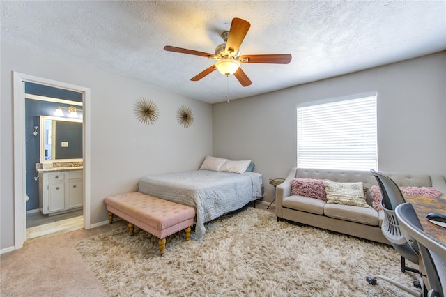 5830 Sampley Way Unit 5830, Houston, TX 77092 - carpeted bedroom featuring connected bathroom, a ceiling fan, and a textured ceiling