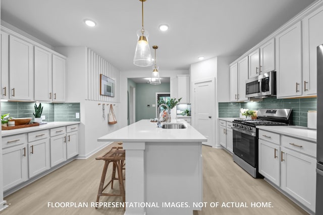 20530 Draper Rd, Tomball, TX 77377 - kitchen with appliances with stainless steel finishes, light wood-type flooring, backsplash, light countertops, and recessed lighting