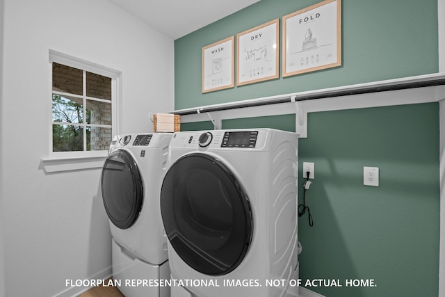 20530 Draper Rd, Tomball, TX 77377 - laundry room with washing machine and dryer and baseboards