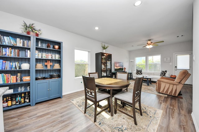 23238 Spring Genesis Ln, Katy, TX 77493 - dining room with light wood-style floors, a ceiling fan, and recessed lighting