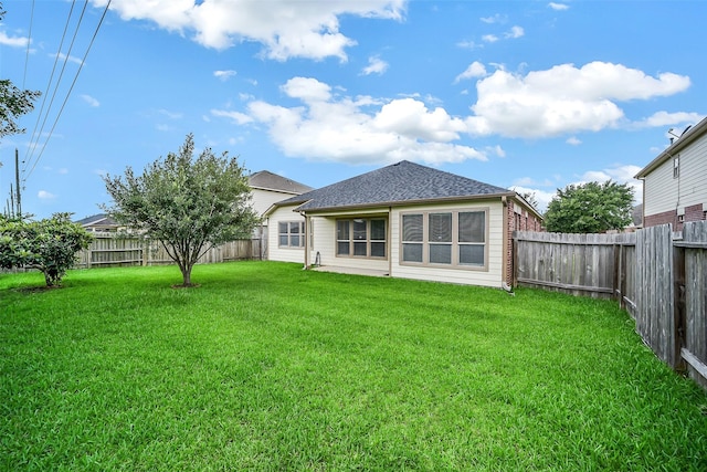 2614 Maverick Park Ln, Katy, TX 77449 - back of house with a fenced backyard and a shingled roof