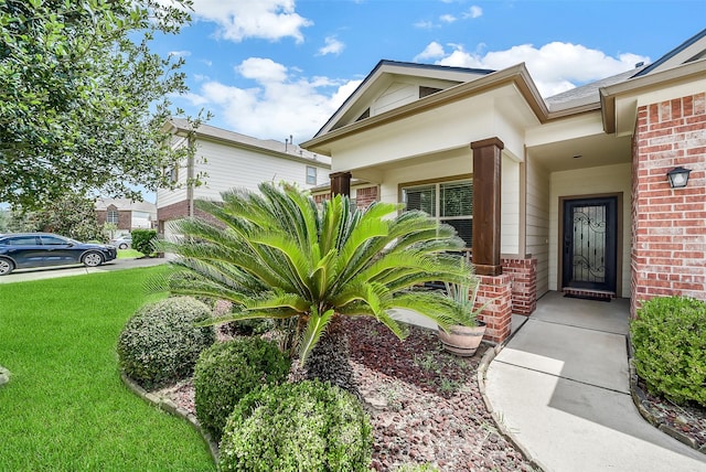 2614 Maverick Park Ln, Katy, TX 77449 - property entrance with brick siding and a yard