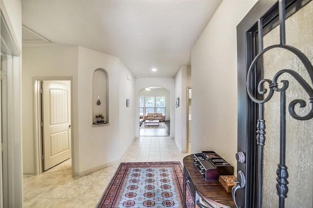 2614 Maverick Park Ln, Katy, TX 77449 - hallway featuring light tile patterned floors and arched walkways