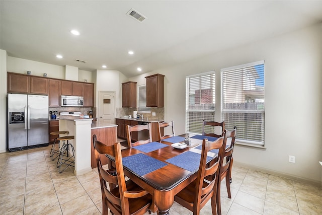 2614 Maverick Park Ln, Katy, TX 77449 - dining area with recessed lighting, light tile patterned flooring, and vaulted ceiling