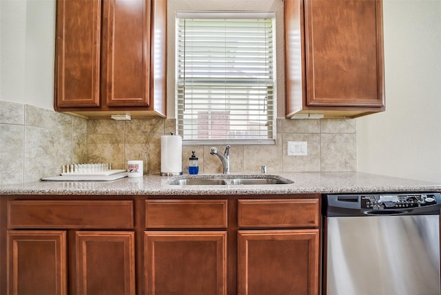 2614 Maverick Park Ln, Katy, TX 77449 - kitchen featuring dishwasher, light stone countertops, decorative backsplash, and brown cabinetry
