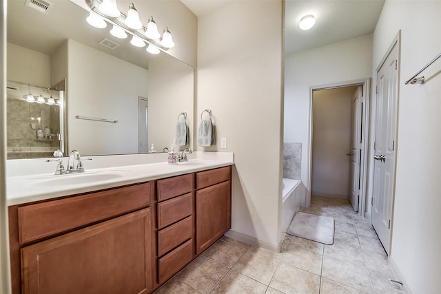 2614 Maverick Park Ln, Katy, TX 77449 - bathroom with double vanity, a bath, and tile patterned floors