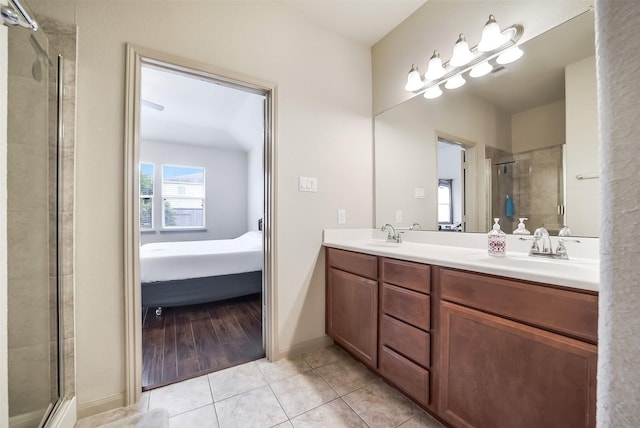 2614 Maverick Park Ln, Katy, TX 77449 - ensuite bathroom featuring tile patterned floors, double vanity, and tiled shower