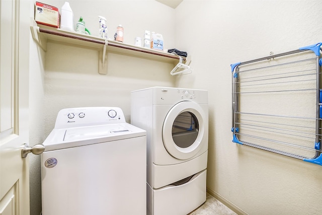 2614 Maverick Park Ln, Katy, TX 77449 - laundry area featuring washer and clothes dryer and light tile patterned floors