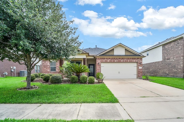 2614 Maverick Park Ln, Katy, TX 77449 - view of front of house featuring a garage, concrete driveway, a front yard, and brick siding