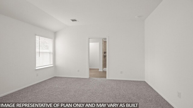 546 Belle Springs Ln, Conroe, TX 77301 - spare room with carpet flooring and lofted ceiling