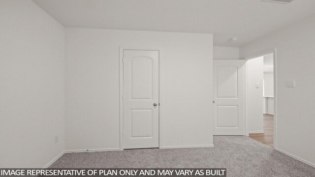 546 Belle Springs Ln, Conroe, TX 77301 - unfurnished bedroom featuring carpet and baseboards