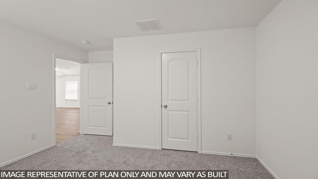 546 Belle Springs Ln, Conroe, TX 77301 - unfurnished bedroom with carpet floors