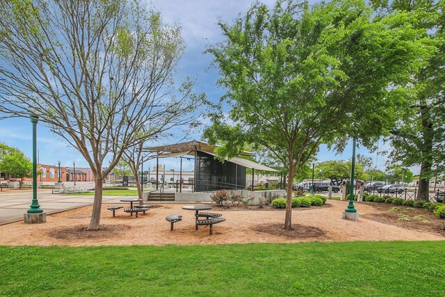 546 Belle Springs Ln, Conroe, TX 77301 - surrounding community featuring a lawn