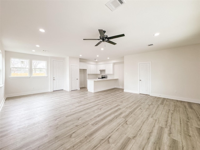 11514 Courtshire Rd, Houston, TX 77076 - unfurnished living room featuring a ceiling fan, recessed lighting, and light wood-style flooring
