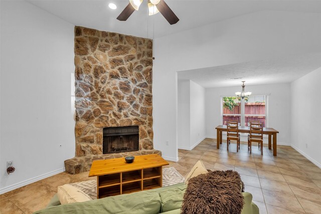 9410 Chapel Pine Ct, Spring, TX 77379 - living area with ceiling fan, a chandelier, a fireplace, and light tile patterned floors