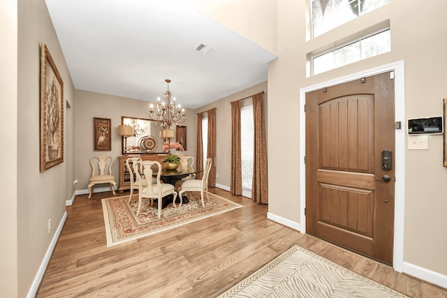 6111 Meadowstream Ct, Katy, TX 77450 - foyer entrance with a chandelier and wood finished floors