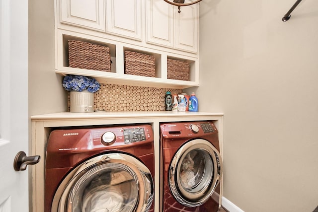 6111 Meadowstream Ct, Katy, TX 77450 - laundry area featuring washing machine and clothes dryer and cabinet space