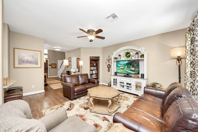 6111 Meadowstream Ct, Katy, TX 77450 - living area featuring a ceiling fan and wood finished floors