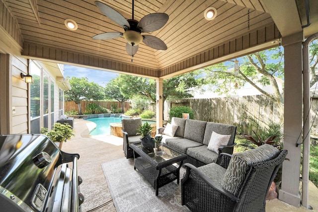6111 Meadowstream Ct, Katy, TX 77450 - fenced backyard featuring grilling area, an outdoor hangout area, a ceiling fan, and a patio area