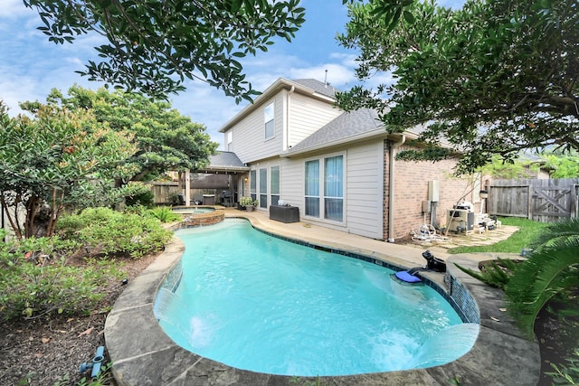 6111 Meadowstream Ct, Katy, TX 77450 - view of pool with a fenced backyard, a patio, and a pool with connected hot tub