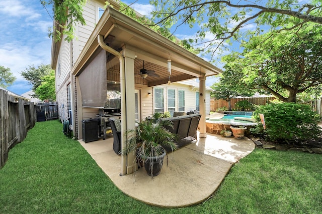 6111 Meadowstream Ct, Katy, TX 77450 - fenced backyard featuring a ceiling fan, a patio area, and area for grilling