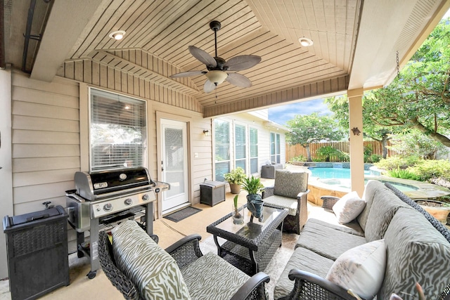 6111 Meadowstream Ct, Katy, TX 77450 - fenced backyard with outdoor lounge area, ceiling fan, a hot tub, grilling area, and a patio area