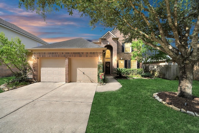 6111 Meadowstream Ct, Katy, TX 77450 - traditional-style home with brick siding, a garage, driveway, and a shingled roof