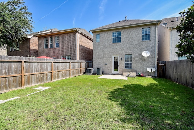 14431 Basalt Ln, Houston, TX 77077 - rear view of property featuring a fenced backyard, brick siding, and a patio