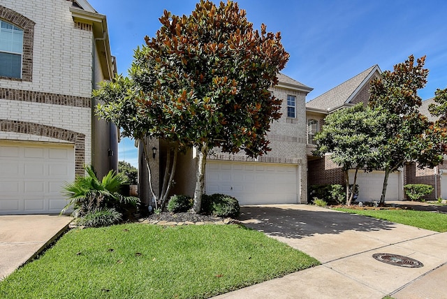14431 Basalt Ln, Houston, TX 77077 - view of front of property with brick siding, driveway, an attached garage, and a front yard
