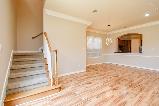 14431 Basalt Ln, Houston, TX 77077 - staircase featuring wood finished floors and crown molding
